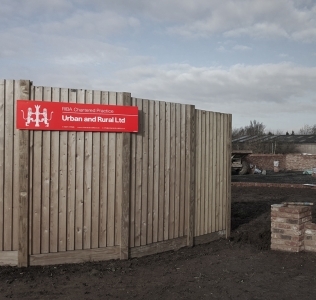 The first Urban and Rural Ltd RIBA sign board goes up at Willow Farm this morning.